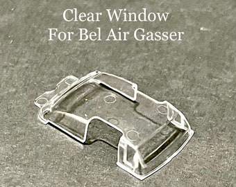 May include: Clear plastic window for a model car, labeled "Clear Window For Bel Air Gasser".