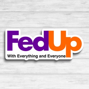 May include: A white sticker with a purple and orange logo that says "FedUp" with the tagline "With Everything and Everyone".