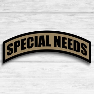 May include: A black and brown patch with the text "SPECIAL NEEDS" in white letters.