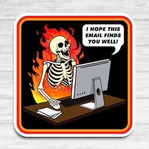 May include: A skeleton sitting at a computer desk with flames behind it. The text on the speech bubble says "I hope this email finds you well!"