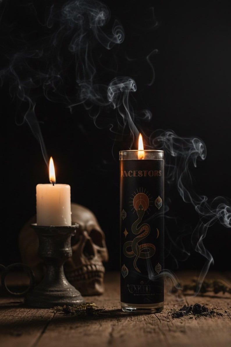 An Oyin Beauty Essentials Ancestor Candle burning alongside a smaller ritual candle with rising smoke, symbolizing ancestral connection, wisdom, and sacred energy.