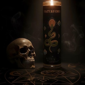 Oyin Beauty Essentials Ancestor Candle glowing under a spotlight beside a skull, with sacred smoke swirling in the background. A luxurious spiritual altar aesthetic representing ancestral reverence and protection.