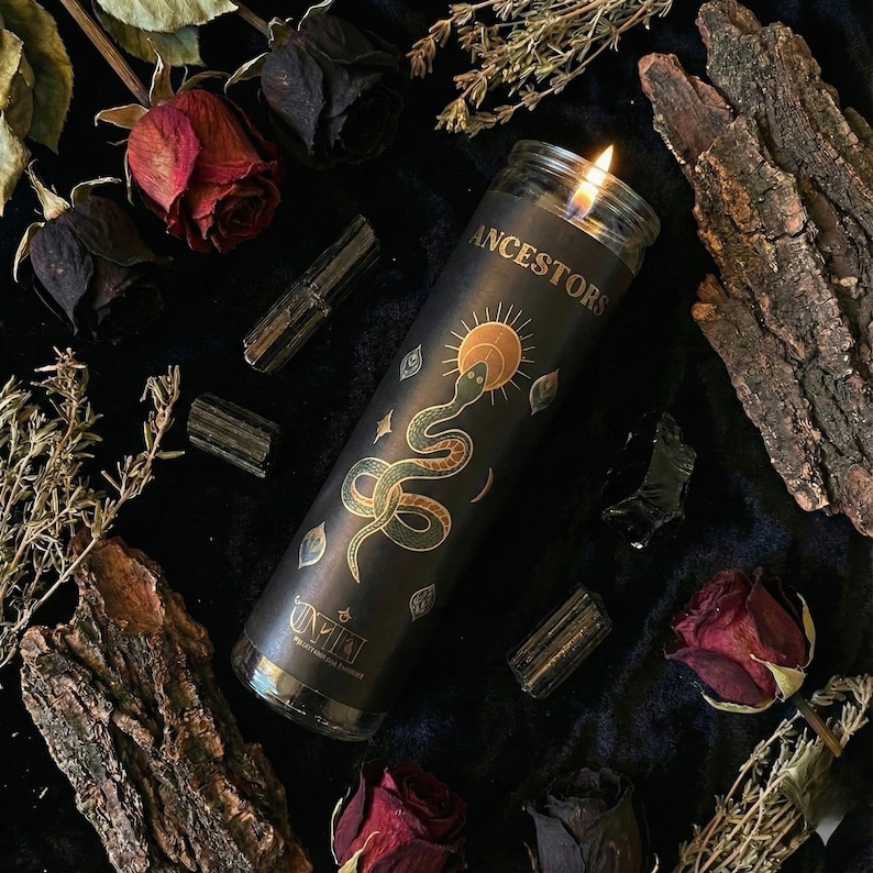 “Ancestral veneration candle in dark ritual flat-lay with dried roses, herbs, bark pieces, and black tourmaline crystals, black meditation candle for ancestral connection and altar décor.”