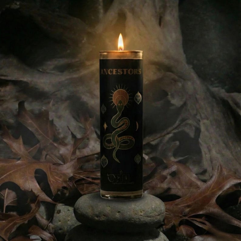 “Ancestral veneration candle lit on stones in a dark forest setting with dried leaves, black ritual candle for meditation, protection, and ancestor connection altar décor.”
