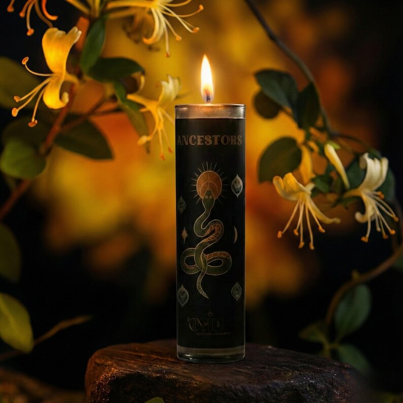 “Lit black ancestor veneration candle on stone pedestal surrounded by yellow honeysuckle flowers, spiritual ritual candle for meditation, ancestral connection, and altar décor.”
