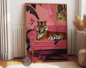 May include: A pink and gold framed illustration of a tiger lounging on a pink velvet sofa. The tiger has orange and black stripes and is looking directly at the viewer. The background is a pink wall with a gold leaf design.