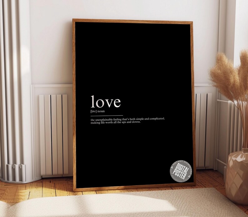 a black picture frame with the words love on it