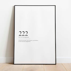 May include: Black and white print with the number 222 and the text "[tü-tü-tü] alignment" and "Trust the journey, stay positive, and believe in the universe's alignment."
