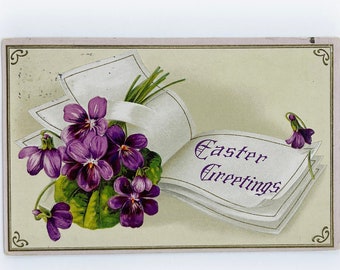 Vintage 1911 Easter Embossed Post Card of an Easter Greetings Book and Purple Flowers with a Benjamin Franklin 1c Stamp