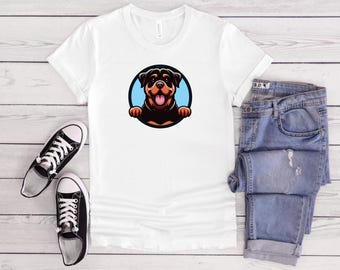 May include: White t-shirt with a cartoon Rottweiler dog peeking out of a blue circle. The dog has brown fur, black ears, and a pink tongue.