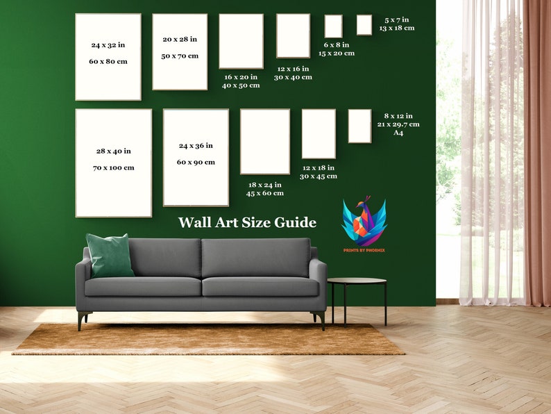 May include: A wall art size guide with different frame sizes in inches and centimeters. The guide is displayed on a green wall with a couch and a rug in front of it.