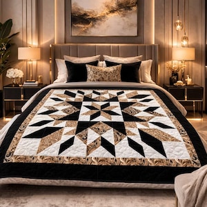 May include: A luxurious bedroom featuring a bed with a star-patterned quilt. The quilt showcases black, white, and gold geometric shapes. The room includes black nightstands, lamps, and a large painting above the bed, creating a sophisticated ambiance.
