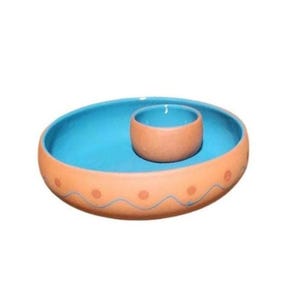 May include: A terracotta serving dish with a blue interior and a smaller matching bowl. The dish has a wavy design with orange dots around the rim.