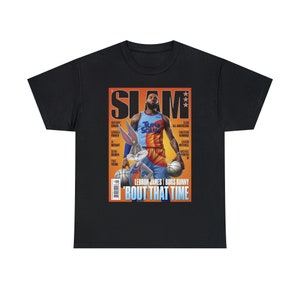 May include: A black t-shirt with a graphic print of a magazine cover featuring LeBron James and Bugs Bunny. The magazine cover is titled "SLAM" and the headline reads "LEBRON JAMES | BUGS BUNNY 'BOUT THAT TIME".