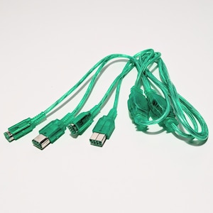 May include: Four green cables with connectors on each end. The cables are coiled together.