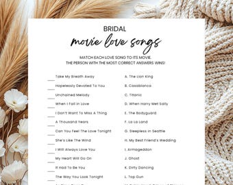 Può includere: Un foglio bianco per un gioco di addio al nubilato, con il titolo "movie love songs" in scrittura nera. Il gioco consiste nell'abbinare canzoni d'amore ai loro film. Il foglio elenca canzoni e titoli di film.