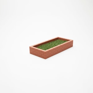 Puede incluir: Una jardinera rectangular de ladrillo con hierba verde en su interior. La jardinera está hecha de ladrillo rojo y tiene un diseño sencillo.