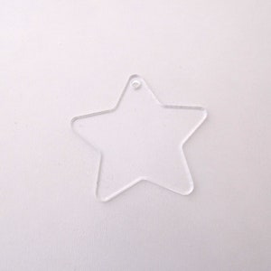 May include: A clear plastic star-shaped ornament with a hole at the top for hanging.