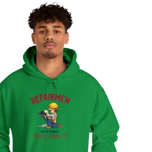 Repairmen: Always &#39;Nail&#39;-ing It Repairmen Unisex Heavy Blend™ Hooded Sweatshirt