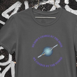 Electricians: We Charge by the Power Unisex Heavy Cotton Tee