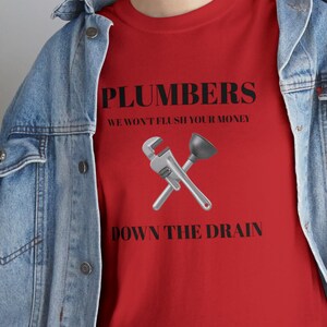 Plumbers: We Won&#39;t Flush Your Money Unisex Heavy Cotton Tee