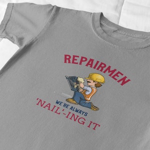 Repairmen: Always &#39;Nail&#39;-ing It Repairmen Unisex Heavy Cotton Tee