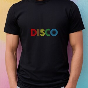 May include: A black t-shirt with a rainbow colored "DISCO" graphic.