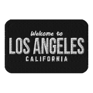 May include: A rustic wooden sign with the text "Welcome to our home" in white lettering. The sign features a distressed finish and a simple, inviting design, perfect for a front porch or entryway.