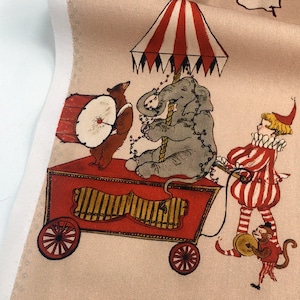 May include: A red and white striped circus tent with a red wagon carrying a gray elephant, a brown bear playing a drum, and a clown in a red and white striped costume. The wagon has a red and gold organ.