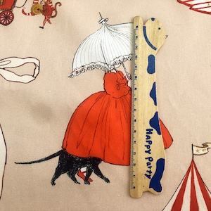 May include: A wooden ruler with a giraffe design and the words "Happy Party" printed on it. The ruler is 12 inches long and has a blue and white color scheme.