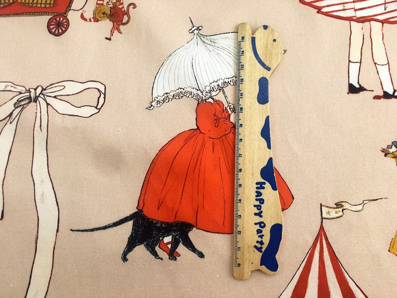 May include: A wooden ruler with a giraffe design and the words "Happy Party" printed on it. The ruler is 12 inches long and has a blue and white color scheme.