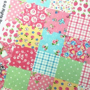 May include: A patchwork fabric with a variety of patterns, including strawberries, roses, and gingham. The squares are in shades of pink, blue, yellow, and green. The text "© All Rights Reserved, Patt.#GZ-C2107152" is visible.