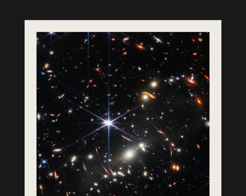 The image is a stunning view of a distant galaxy, showcasing a multitude of stars and celestial objects. The star cluster appears to be composed of numerous bright stars, creating a captivating and visually striking scene. The image is a captivating representation of the vastness and beauty of the universe, with the stars and their intricate patterns and formations filling the frame.