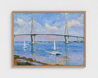 May include: An oil painting in a wooden frame depicting a cable-stayed bridge spanning a wide body of water. Two white sailboats are visible on the blue water under a sky with soft clouds. The foreground shows a shoreline with earthy brown tones.
