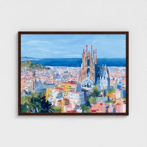 May include: A framed painting of a cityscape featuring a cathedral. The artwork uses a vibrant palette of blues, oranges, and reds, depicting buildings and a body of water under a blue sky. The frame is a dark brown colour.