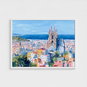 May include: A framed watercolour painting depicting a cityscape with a notable cathedral. The artwork showcases a blue sky, a body of water, and a vibrant collection of buildings in pink, yellow, and blue. The cathedral displays detailed architectural features.