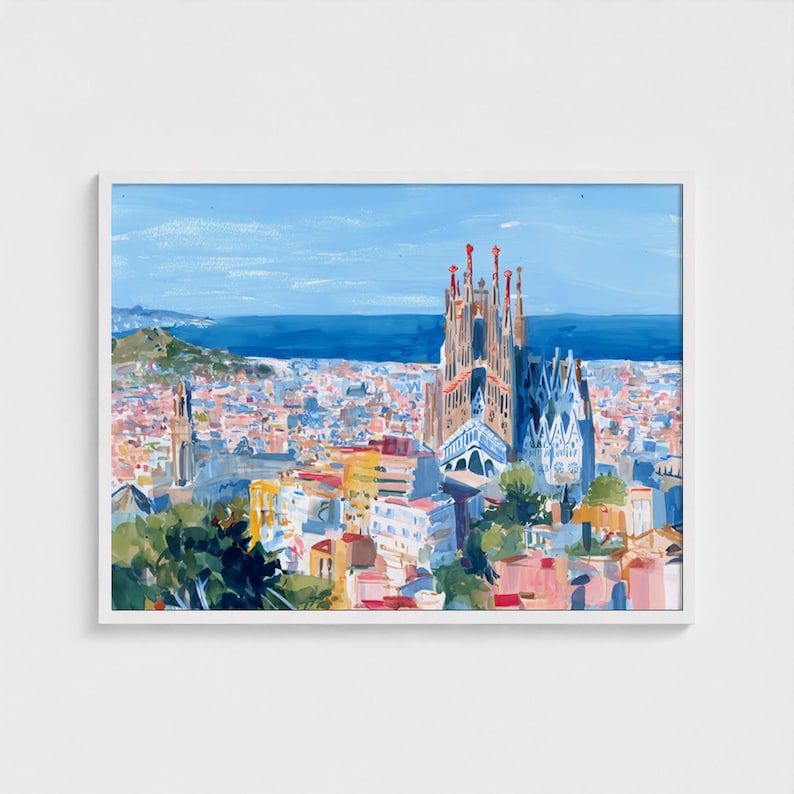 May include: A framed watercolour painting depicting a cityscape with a notable cathedral. The artwork showcases a blue sky, a body of water, and a vibrant collection of buildings in pink, yellow, and blue. The cathedral displays detailed architectural features.