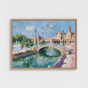 Puede incluir: Pintura al óleo de un paisaje urbano europeo con un puente sobre un canal. La obra de arte presenta un cielo azul claro con nubes, un puente con detalles ornamentados y edificios con torres. La pintura está enmarcada en un marco de madera marrón claro.