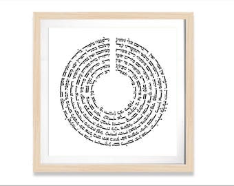 May include: Framed artwork featuring a circular design of black Hebrew text on a white background. The text is arranged in concentric circles, with a light wood frame. The artwork is a decorative piece.