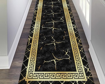 May include: Black and gold runner rug with a marble pattern and a Greek key border. The rug is made of durable, easy-to-clean material and is perfect for high-traffic areas.