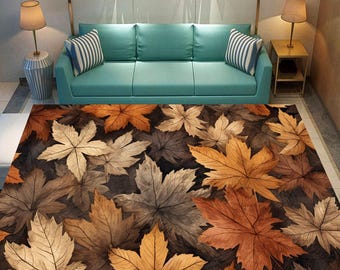 May include: A brown and orange area rug with a pattern of autumn leaves. The rug is in a living room setting with a blue sofa and a side table.
