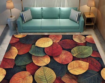 May include: A brown, beige, red, and green area rug with a leaf pattern. The rug is made of a soft, plush material and is perfect for adding a touch of nature to any room.