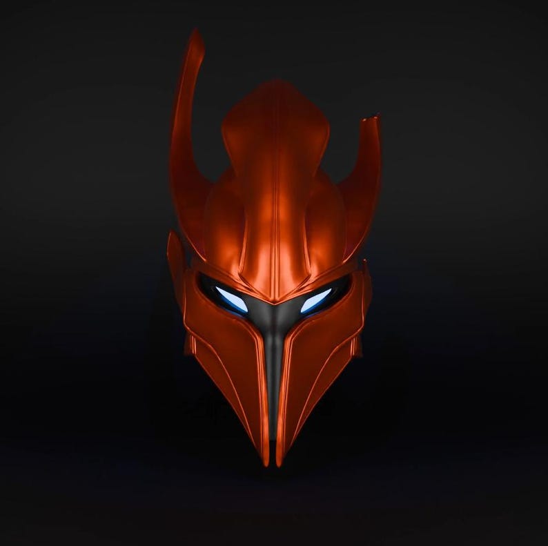 May include: A red and black helmet with a pointed top and glowing blue eyes. The helmet is made of a smooth, metallic material.