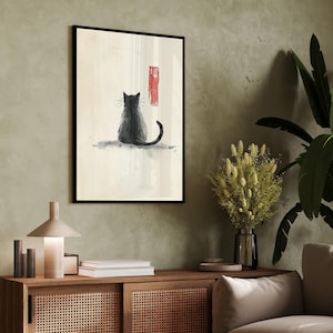 以下が含まれることがあります： 白い背景に猫が座っている白黒の水彩画。猫は鑑賞者から背を向けており、長い尻尾があります。絵は黒い額縁に入っています。