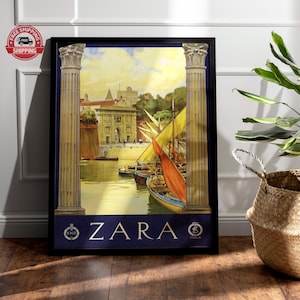 May include: A framed vintage travel poster featuring a harbor scene with sailboats and buildings. The poster has a dark blue border and the word "ZARA" in white letters. The poster includes the text "ENIT" and "ITALIA".