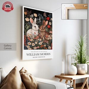 May include: A gallery canvas print featuring a vintage illustration of two rabbits in a field of flowers. The text "THE ARTISTRY OF 19TH CENTURY WILLIAM MORRIS HISTORY OF BRITISH ART" is printed below the image.