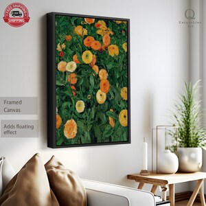 K&ouml;nnte beinhalten: Gerahmter Leinwanddruck eines Gem&auml;ldes mit einem Feld aus gelben und orangefarbenen Blumen mit gr&uuml;nen Bl&auml;ttern. Das Gem&auml;lde ist in Schwarz gerahmt.