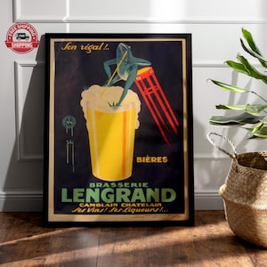 May include: Vintage framed poster featuring a frog atop a beer glass with the text "Son régal!!" and "Bieres Brasserie Lengrand". The poster has a dark background with red, yellow, and green accents. The poster is in a black frame.