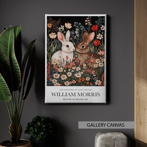 May include: A vintage-style art print featuring two rabbits in a field of flowers. The print is titled "William Morris" and includes the text "The Artistry of 19th Century, History of British Art".