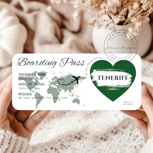 May include: A boarding pass with the text "Boarding Pass" at the top. The pass includes the passenger's name, travel dates, and a message. A green heart shape with the word "TENERIFE" is on the right.